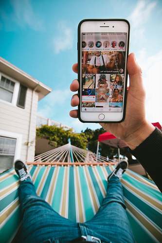 watsonville person on hammock using iPhone electronics